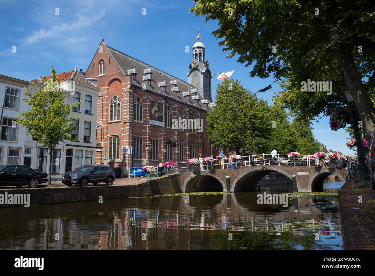 Leiden, Holland - July 05, 2019: University building at the Rapenburg with a flag for the celebration of 444 years university Stock Photo