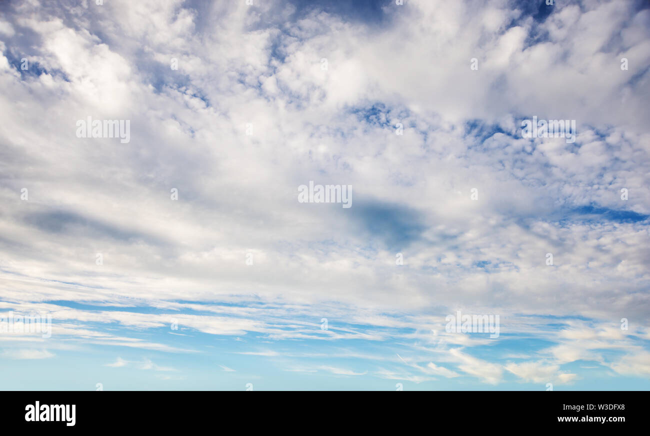 Beautiful blue sky with clouds as a natural background Stock Photo - Alamy