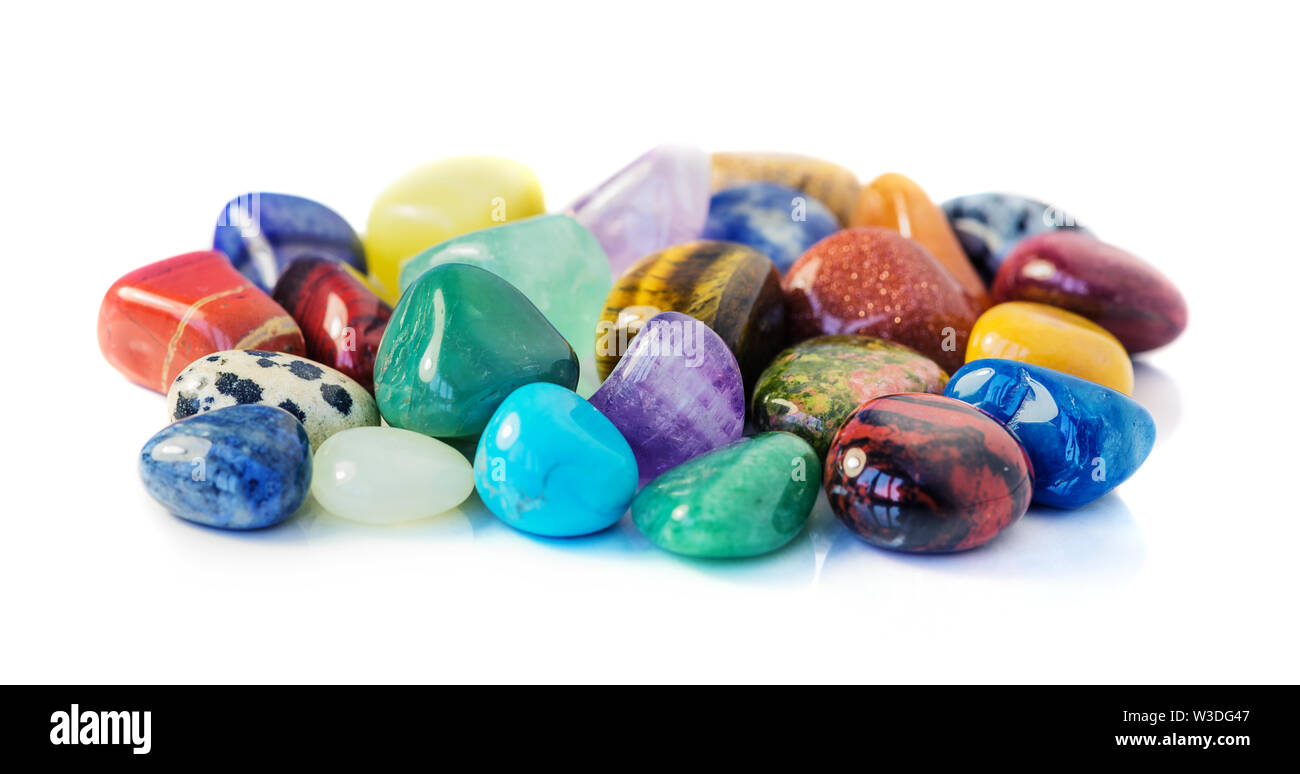 Lot of various multicolored gems isolated on white background Stock Photo