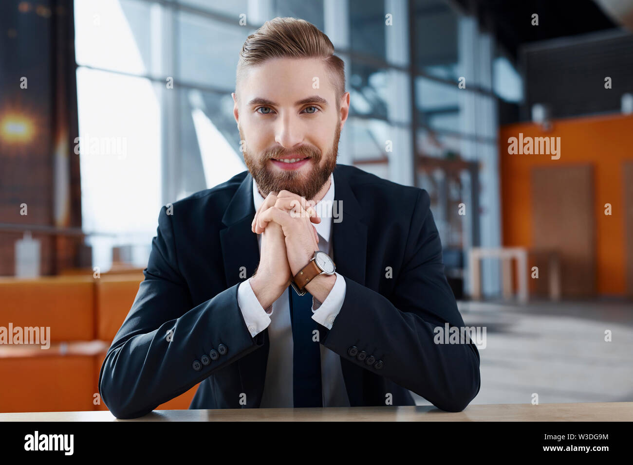 Happy young hipster businessman at modern office Stock Photo