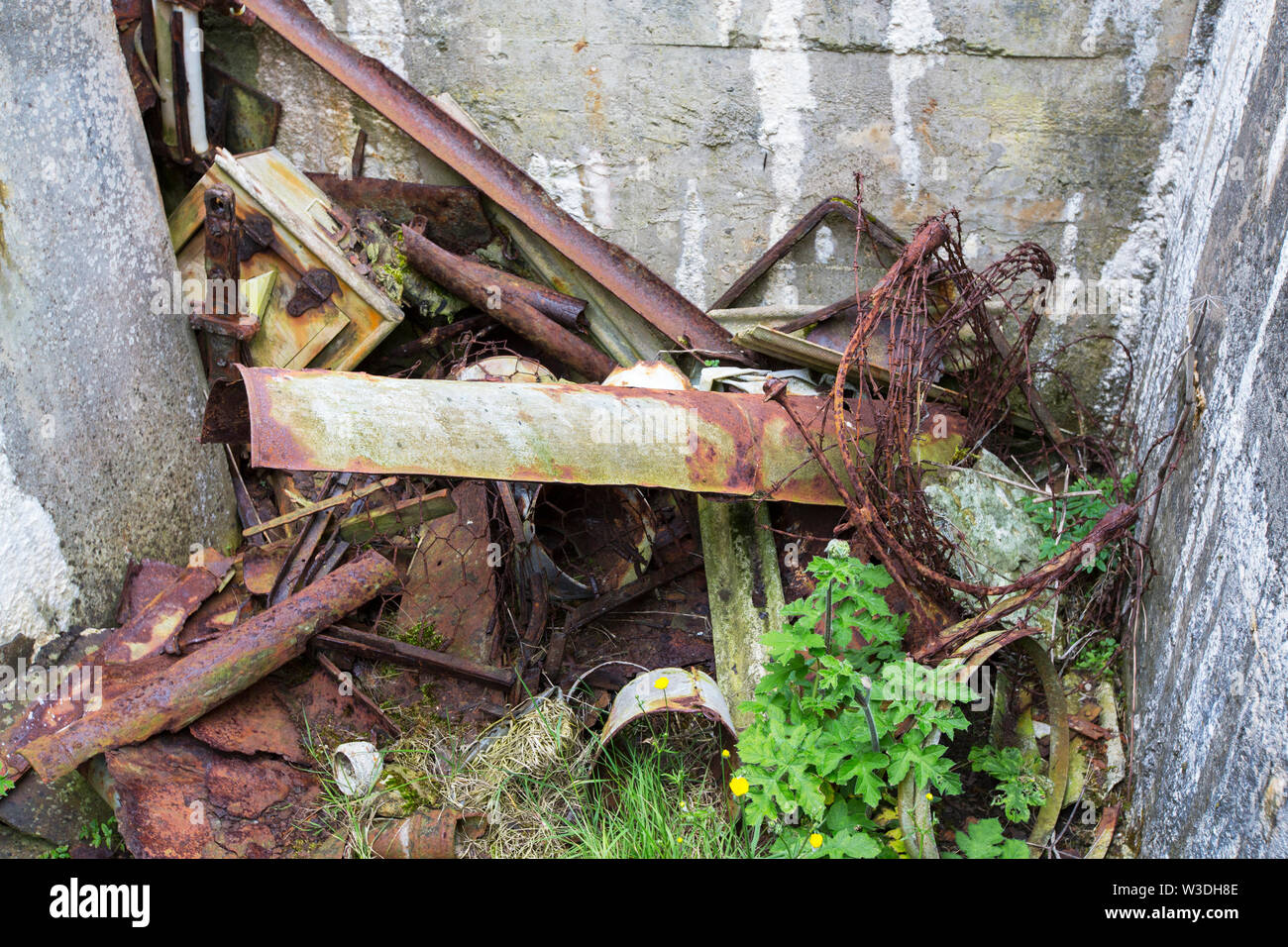 Second World War buildings and rusting metal on Rerwick Point, Orkney Islands, Scotland, UK. Stock Photo