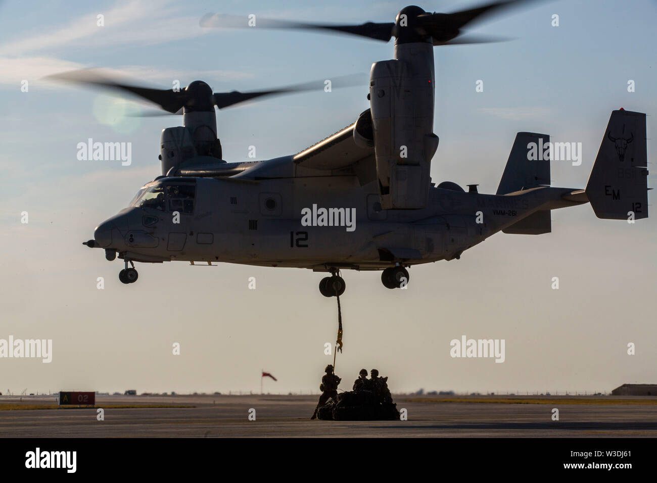 A U.S. Marine Corps MV-22B Osprey with Special Purpose Marine Air-Ground Task Force-Crisis Response-Africa 19.2, Marine Forces Europe and Africa, conducts an external lift during helicopter support team training on Moron Air Base, Spain, July 9, 2019. The exercise was conducted to increase interoperability between the aviation combat element and logistics combat element. SPMAGTF-CR-AF is deployed to conduct crisis-response and theater-security operations in Africa and promote regional stability by conducting military-to-military training exercises throughout Europe and Africa. (U.S. Marine Cor Stock Photo