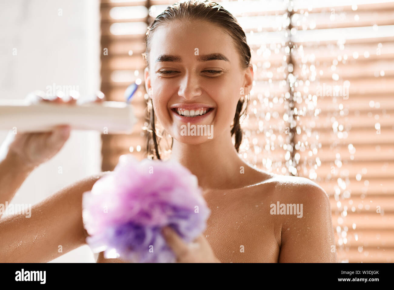 Happy Girl Putting Shower Gel On Puff Stock Photo Alamy