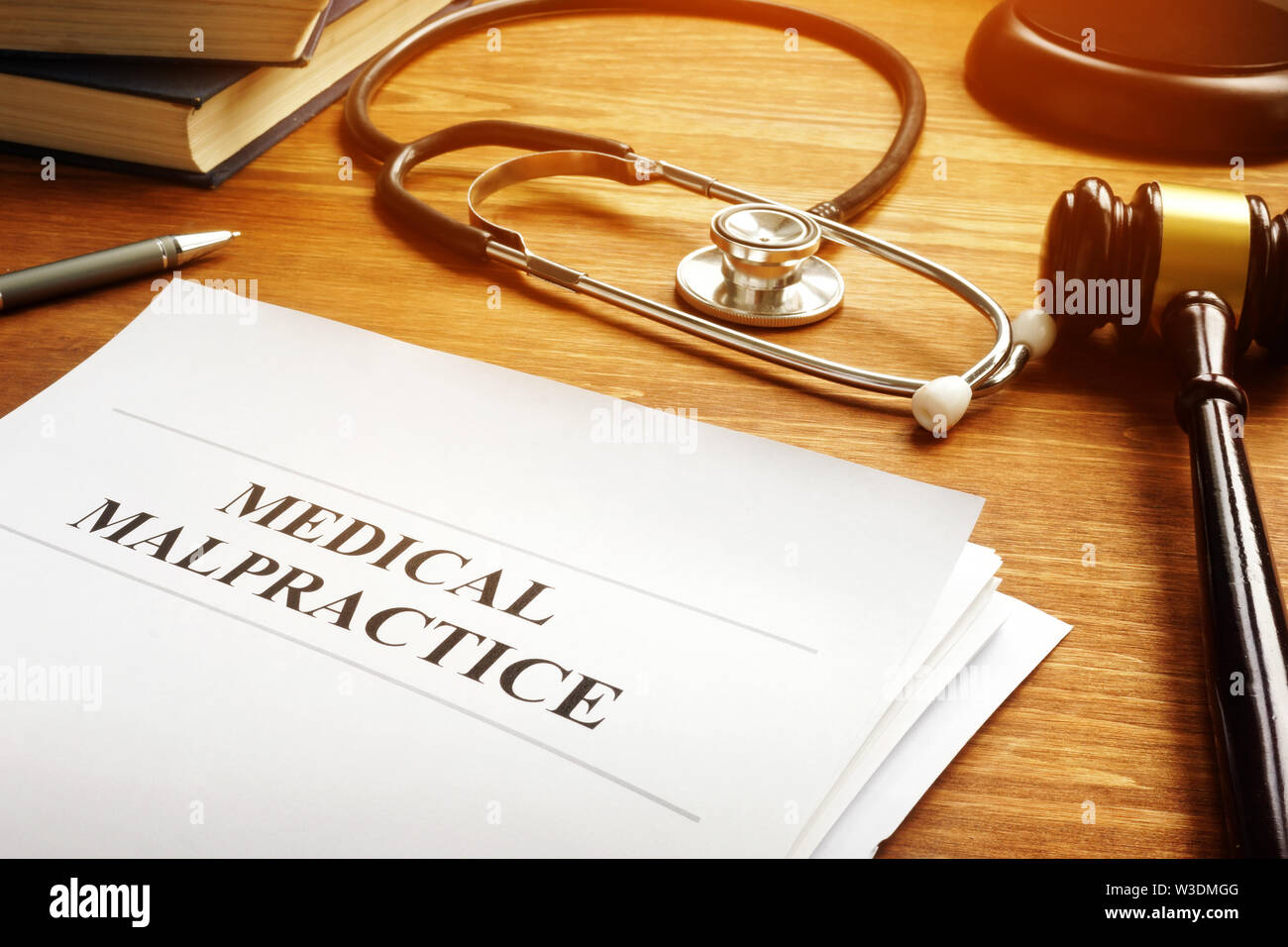 Medical malpractice report and stethoscope. Stock Photo