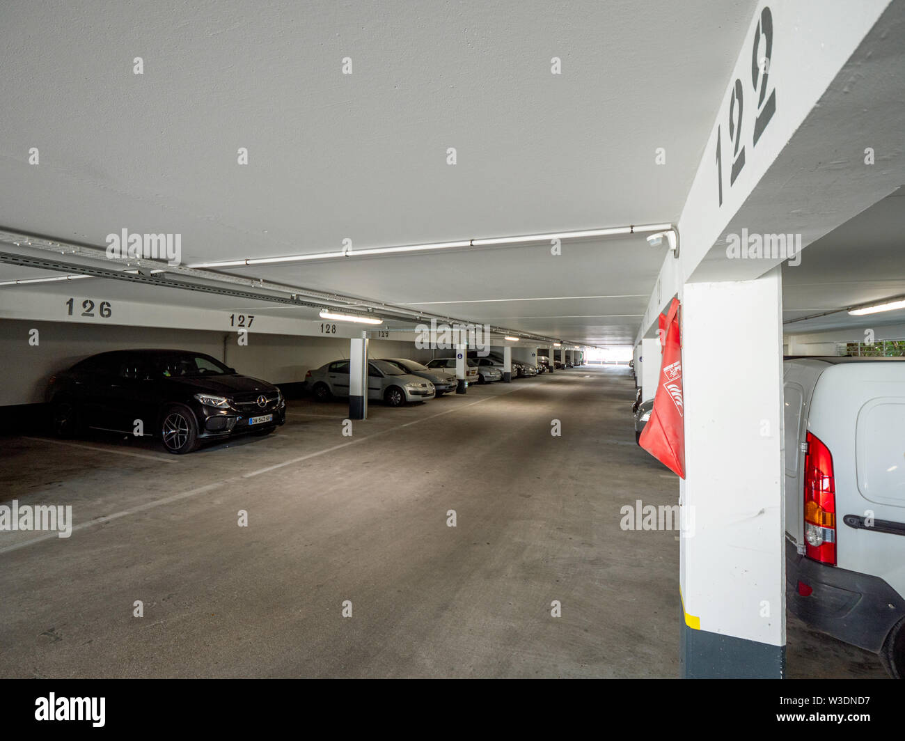 Saint-Gratien, France - Jul 15, 2018: Wide view over interior of modern parking with Mercedes-Benz SUB and other cars Stock Photo