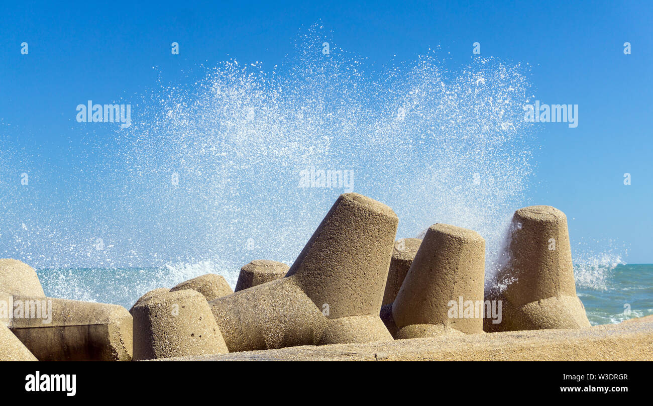 Italy, Apulia, Giovinazzo, waves on the pier Stock Photo