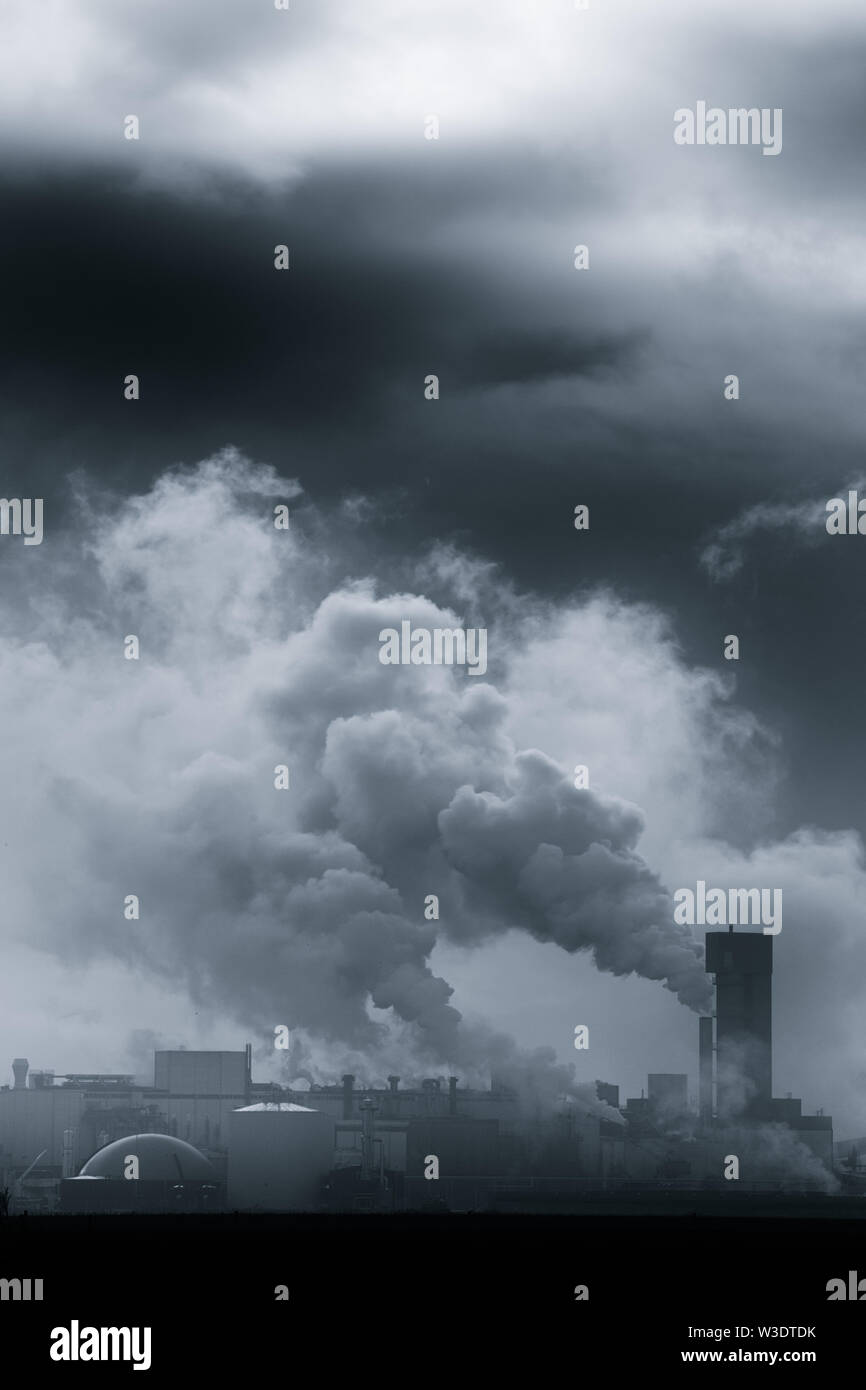 A chemical plant polluting the air and causing rising temperatures and global warming - The Netherlands Stock Photo