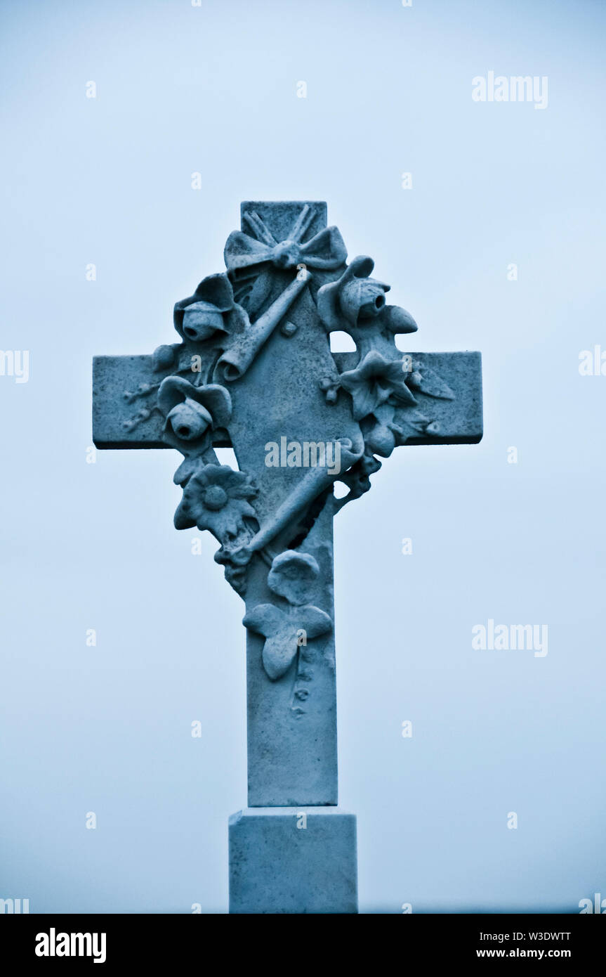cross over a tombstone, isolated Stock Photo