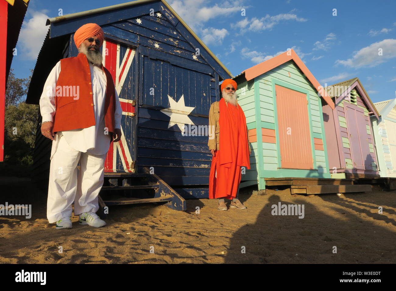 Multicultural Melbourne Australia . The Brighton beach boxes attract a diverse colourful crowd. Stock Photo