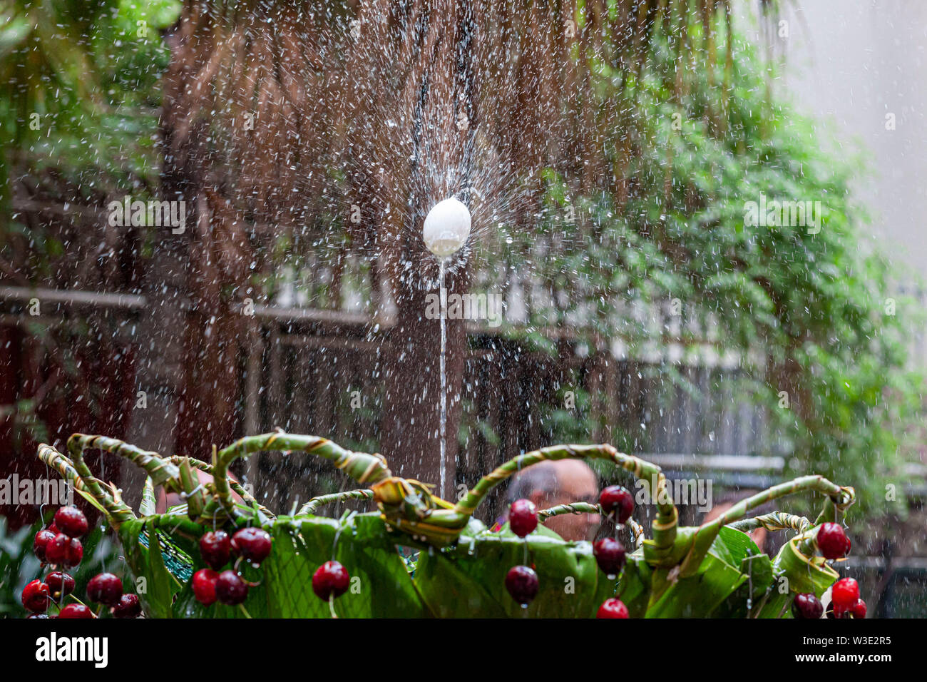 Barcelona, Spain. Interior garden of Ateneu Barcelones. Ou com balla in fountain, Corpus day tradition. Stock Photo
