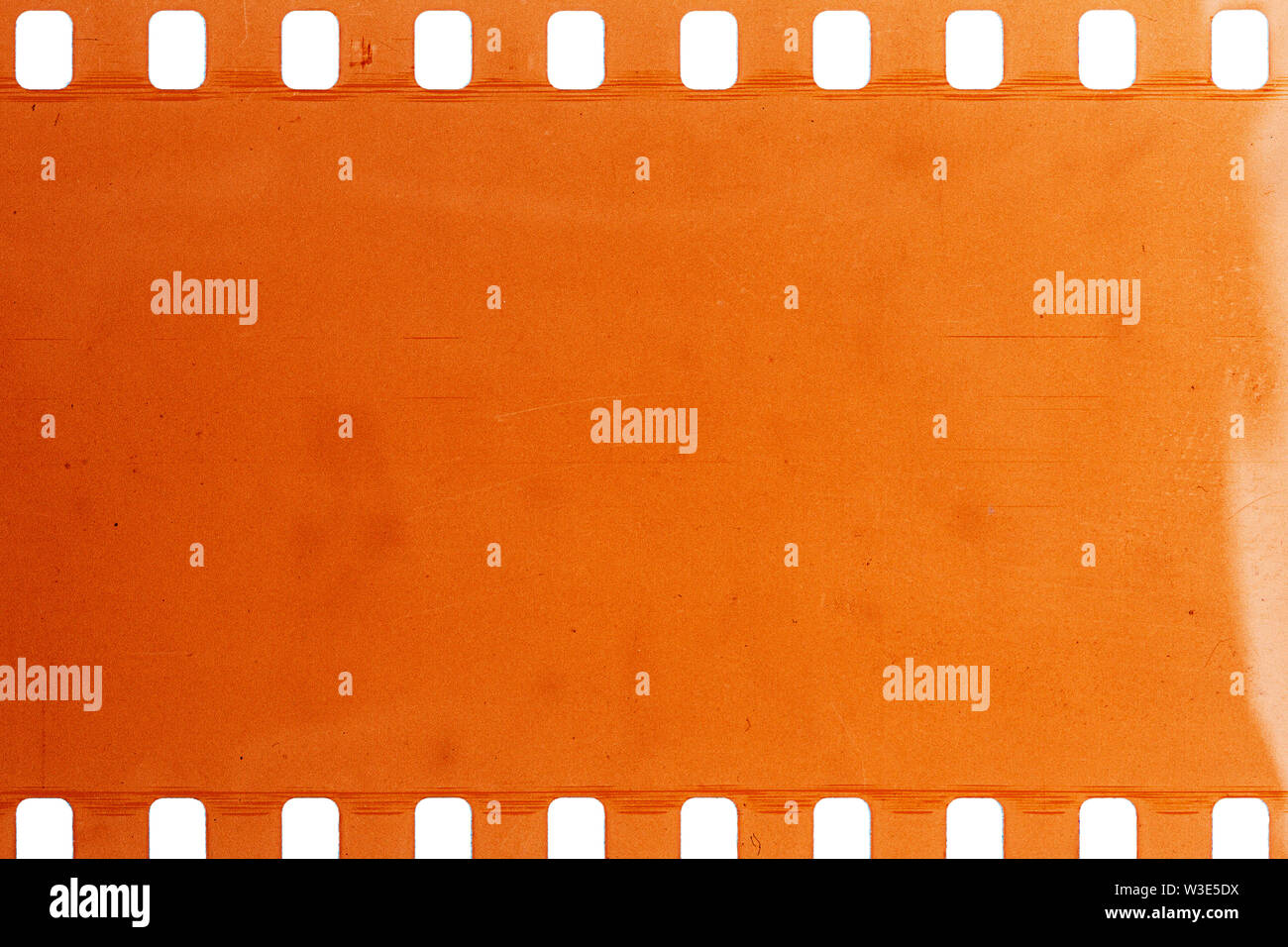 Blank yellow vibrant noisy filmstrip isolated on white background Stock Photo