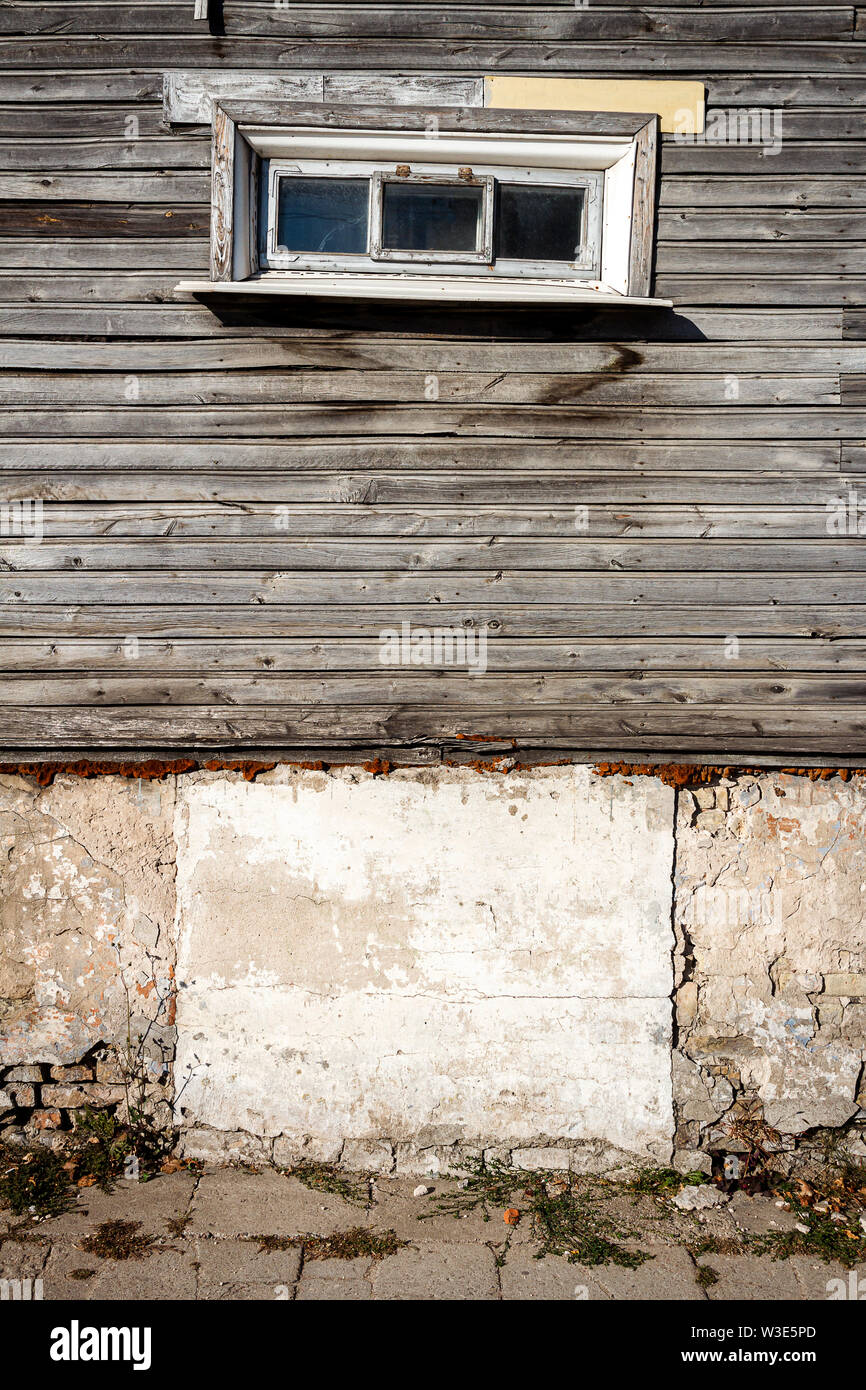 Old window on a aged wooden plank wall. Architectural detail ...