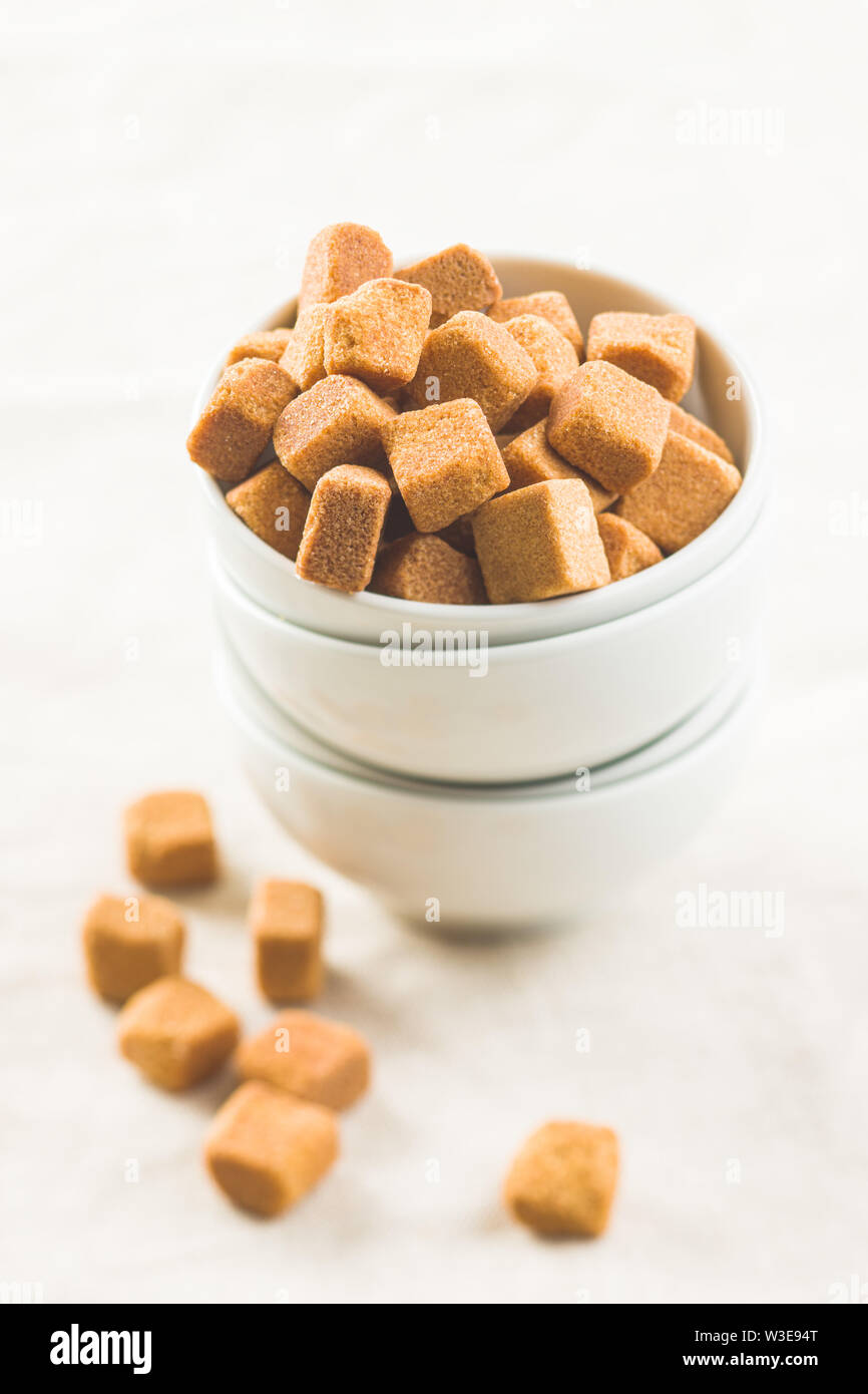 Brown sugar cubes in bowl. Stock Photo