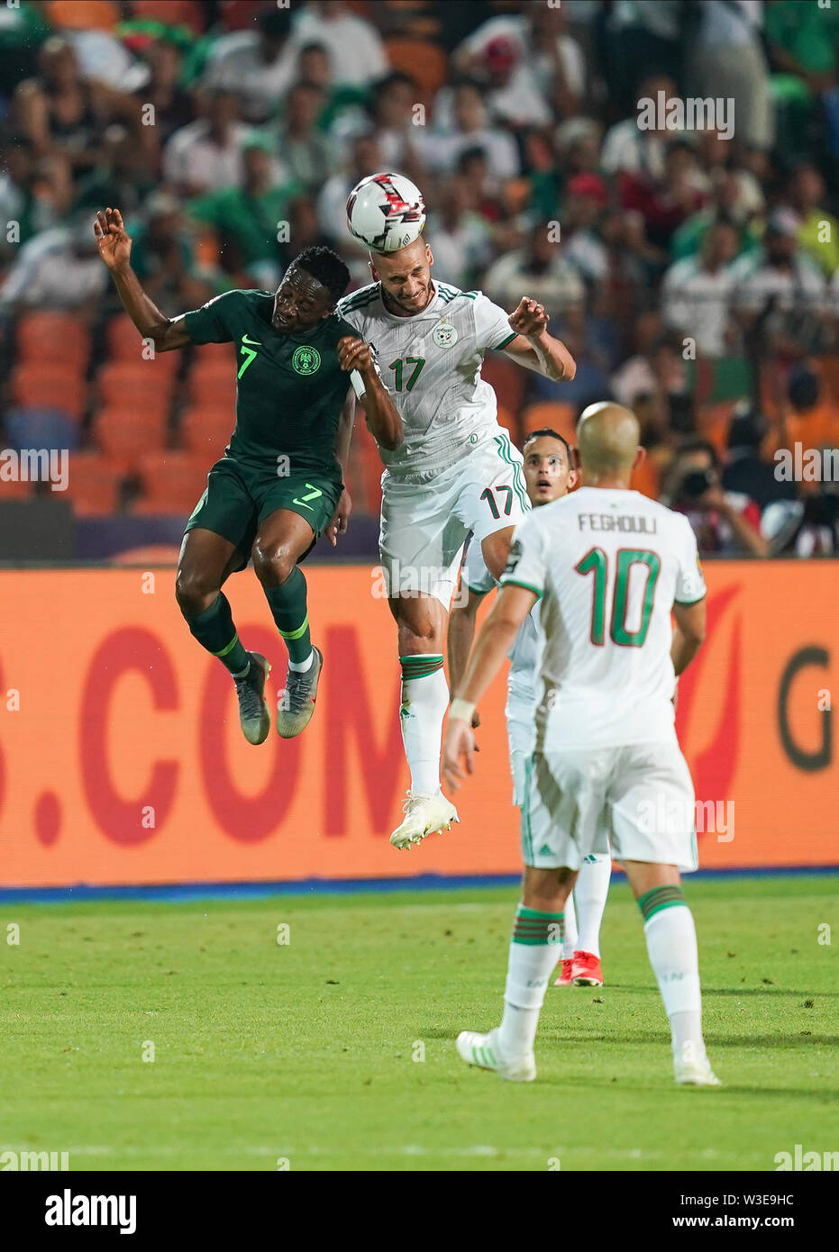 Cairo, Algeria, Egypt. 14th July, 2019. FRANCE OUT July 14, 2019: Adlane Guedioura of Algeria and Ahmed Musa of Nigeria challenging for the ball during the 2019 African Cup of Nations match between Algeria and Nigeria at the Cairo International Stadium in Cairo, Egypt. Ulrik Pedersen/CSM/Alamy Live News Stock Photo