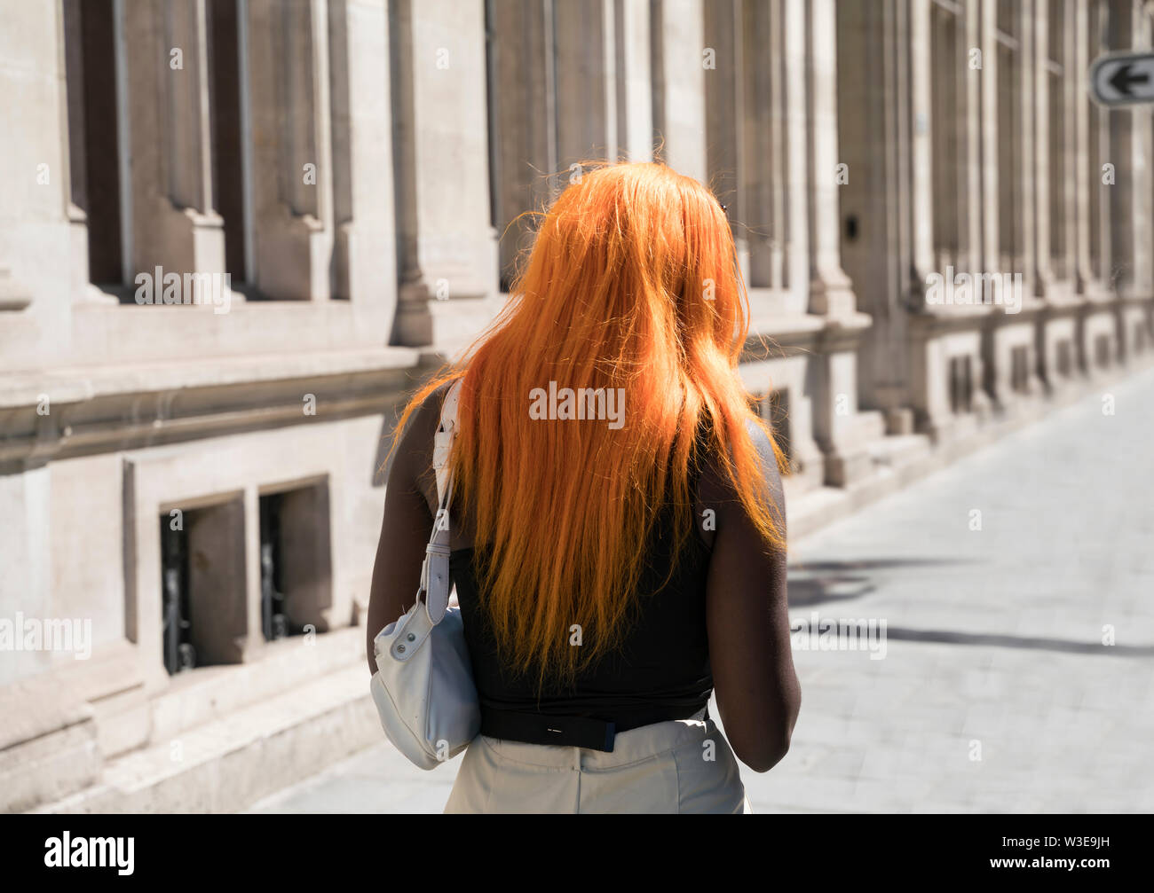 Black woman with orange hair in Paris Stock Photo