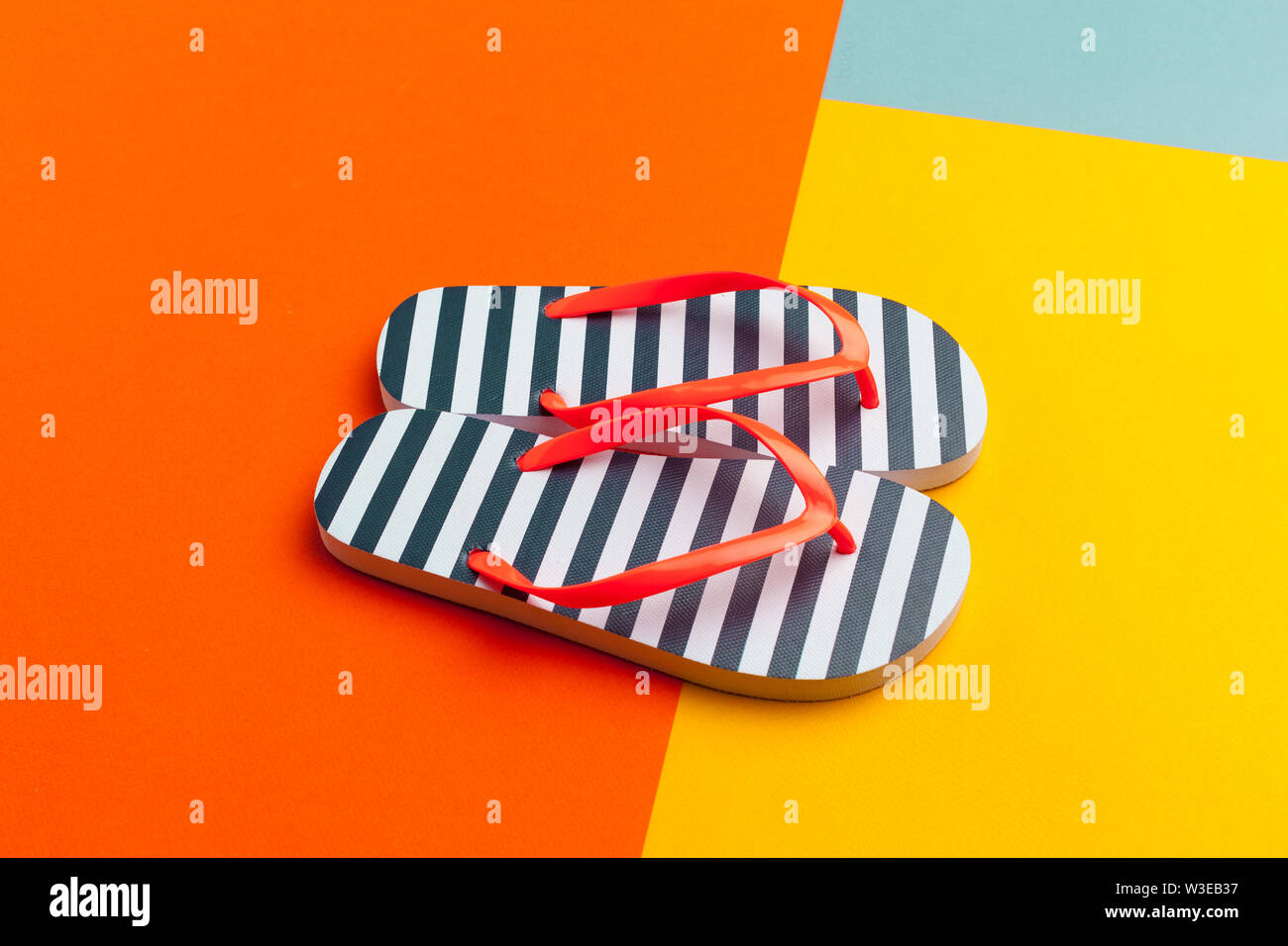 Female flip flops on a colorful vibrant background Stock Photo - Alamy