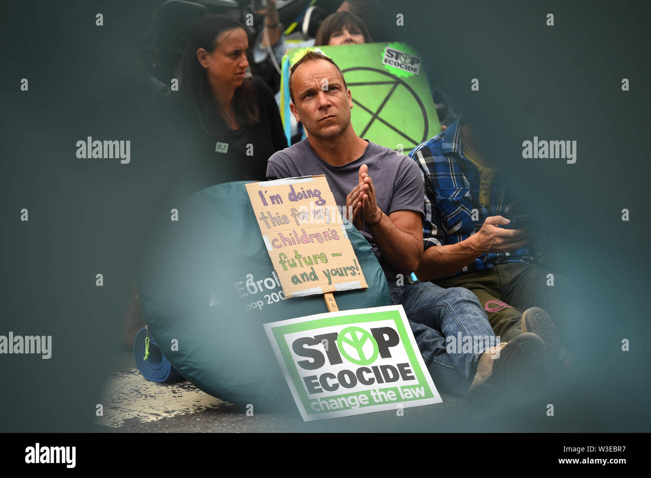 Protesters from Extinction Rebellion outside the Royal Courts of Justice in London. Stock Photo