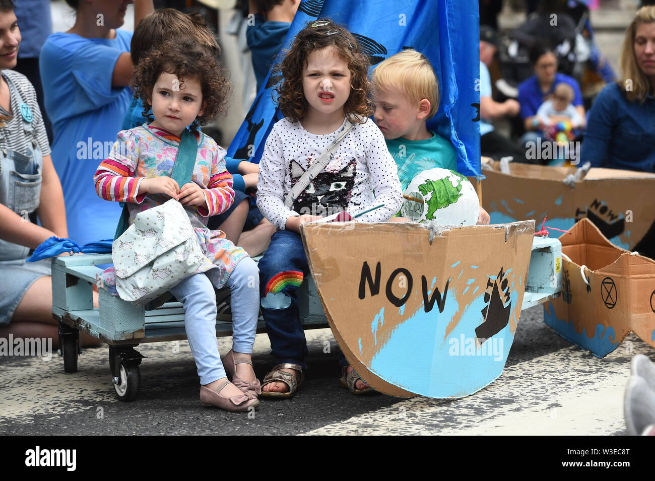 PARENTAL PERMISSION GIVEN Protesters from Extinction Rebellion outside the Royal Courts of Justice in London. Stock Photo