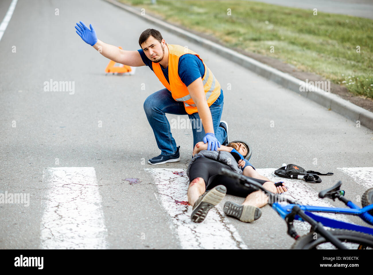 Road accident with injured cyclist on the pedestrian crossing with ...