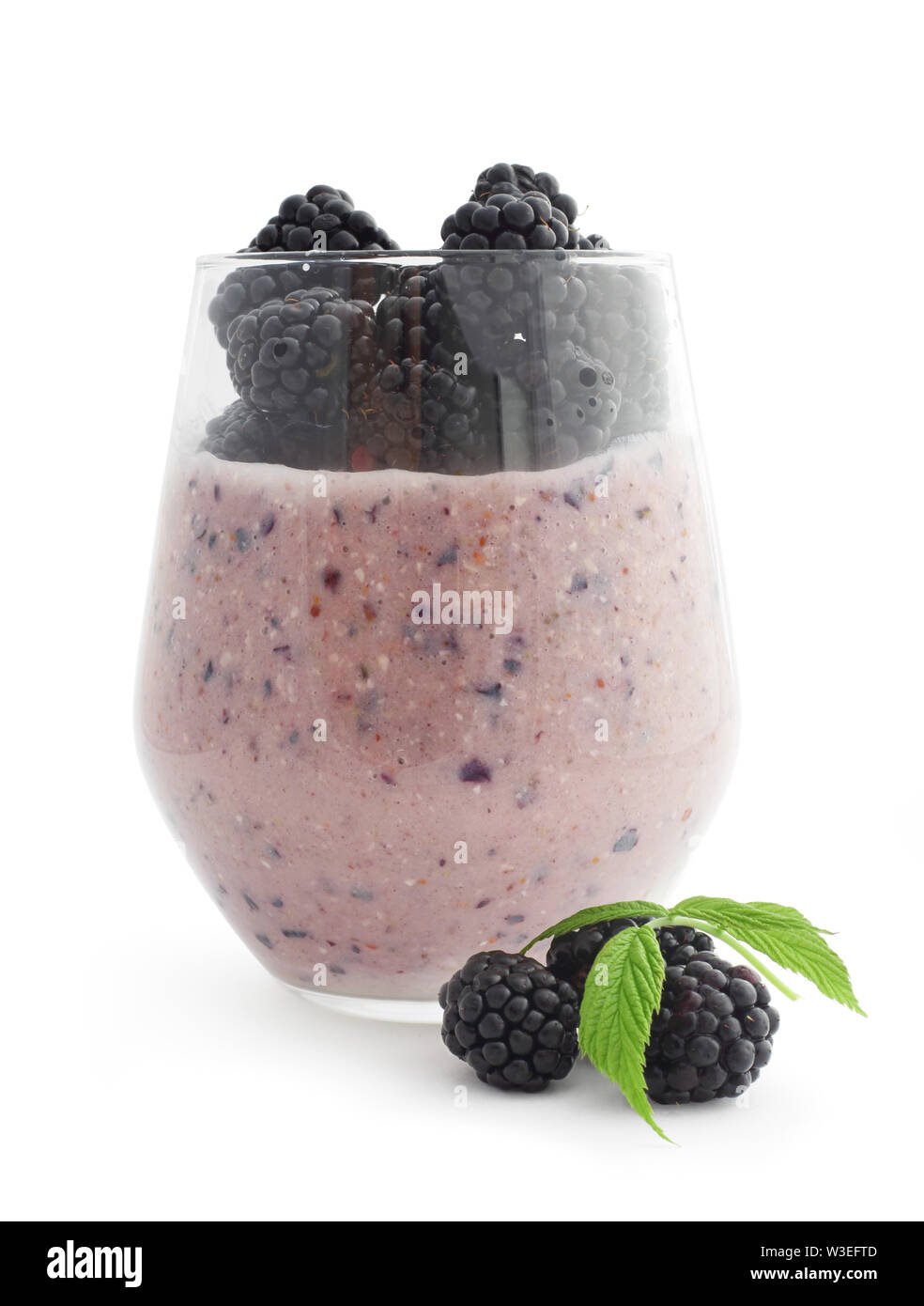Smoothie and fresh berries blackberry studio isolated on white background Stock Photo