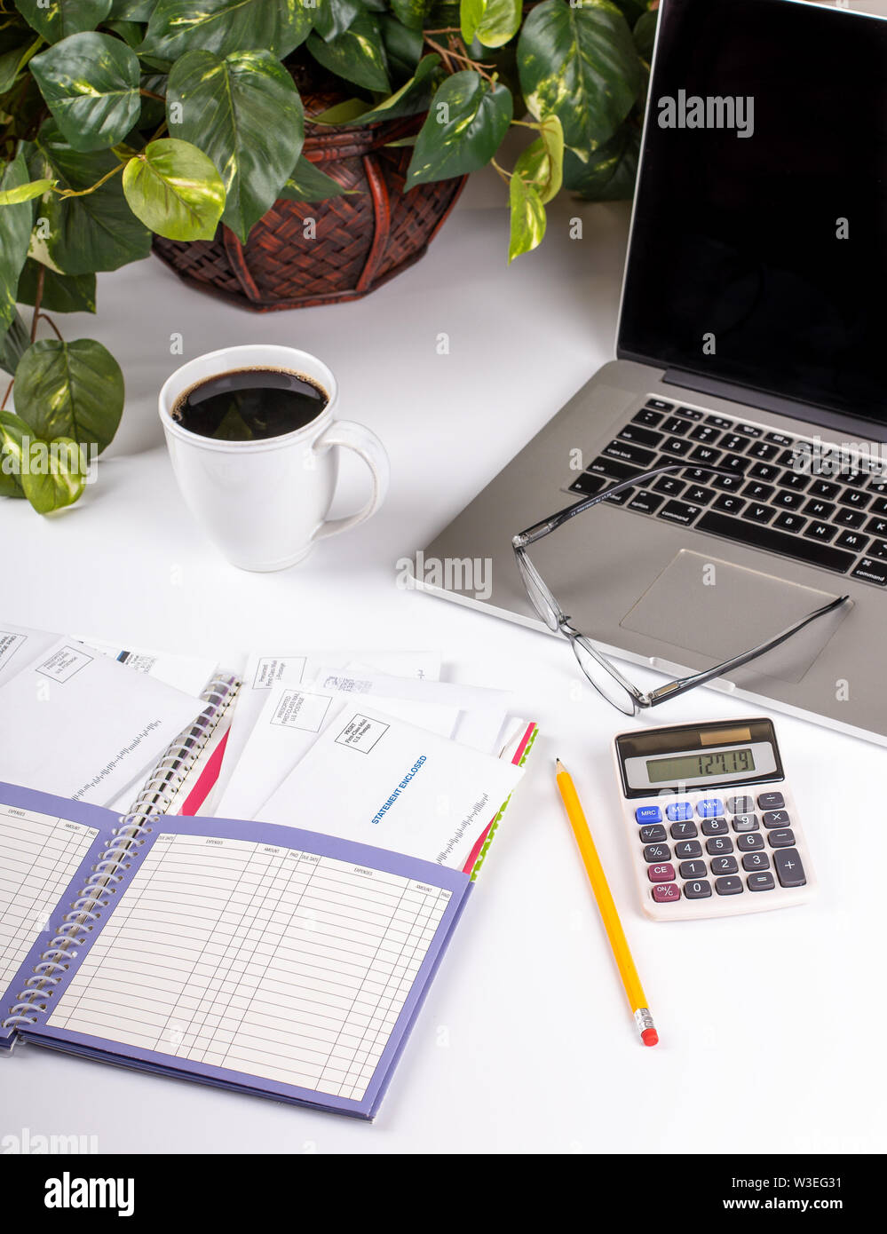 Home finance planner and bill organizer with office accessories on a