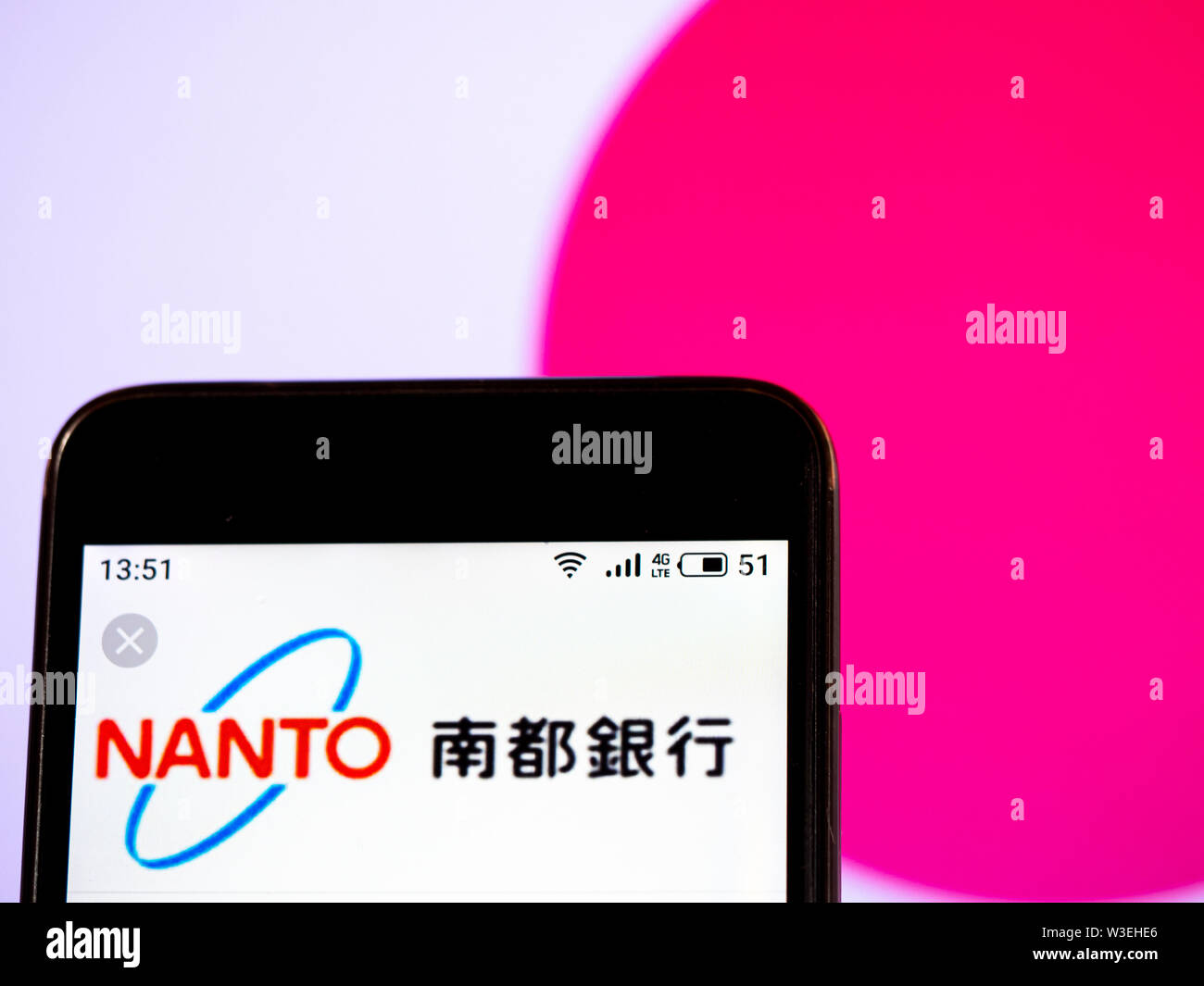 In this photo illustration The Nanto Bank, Ltd.  logo is seen displayed on a smartphone Stock Photo