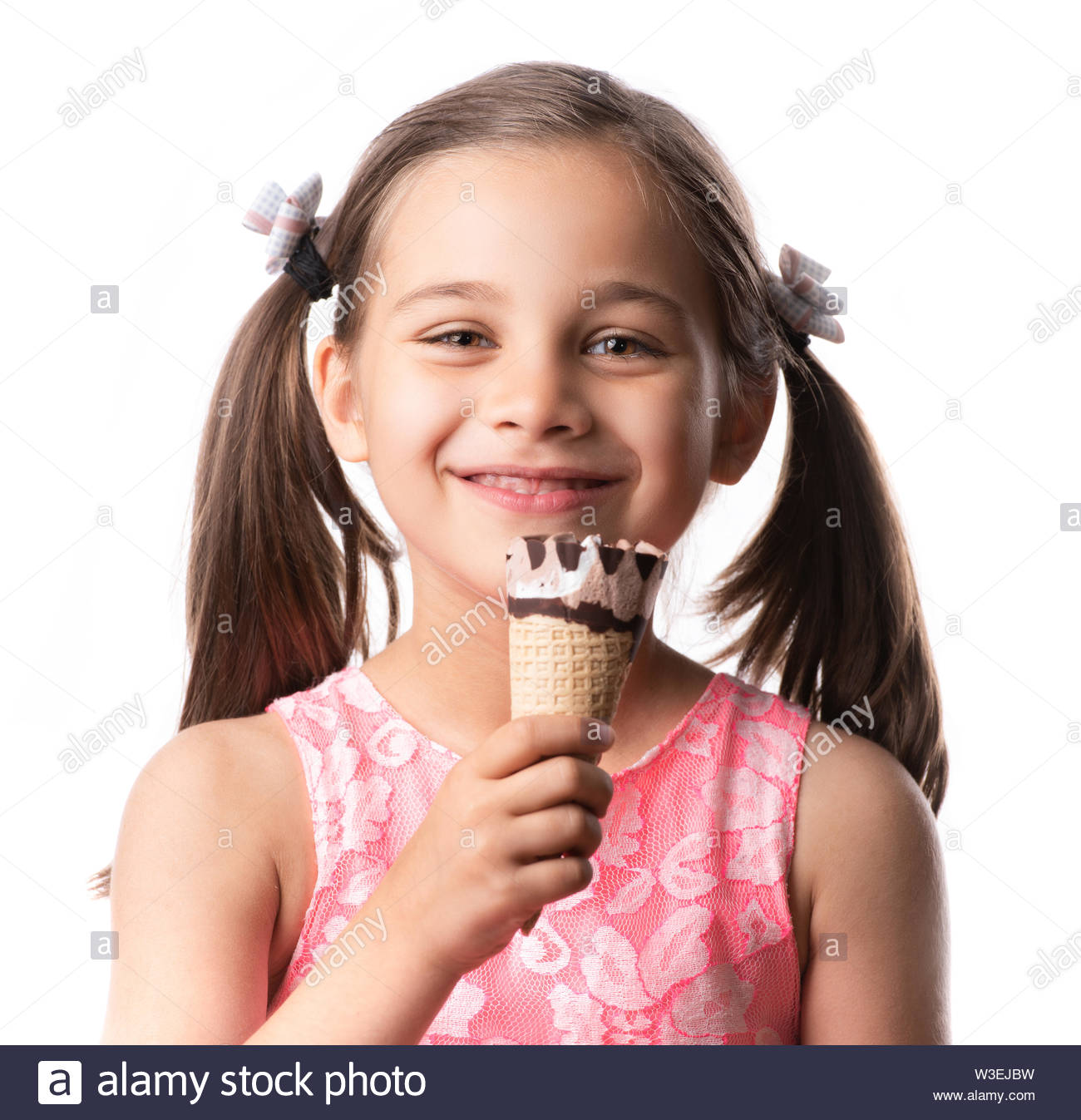 Smiling Kid Girl Eating Ice Cream Isolated