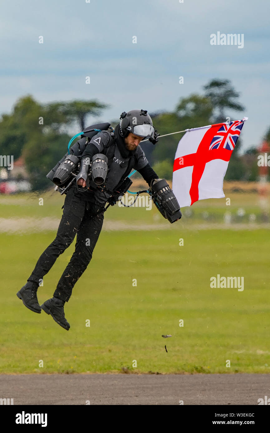 Richard Browning the former Royal Marines Reservist and founder of Gravity Industries demonstrates his jet powered flying suit at Yeovilton Air Day. Stock Photo