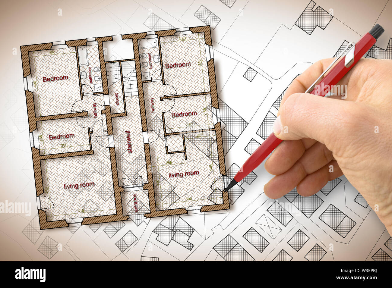 Architect drawing a residential building over an imaginary cadastral ...