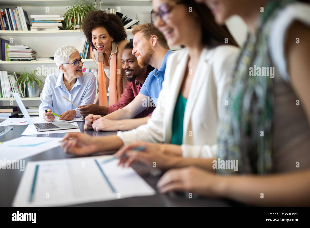 Group of successful business people at work in office Stock Photo - Alamy