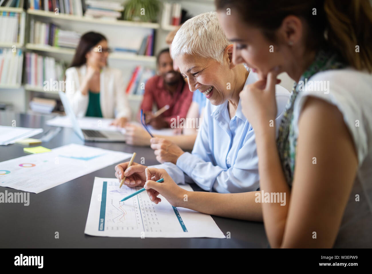 Group of successful business people at work in office Stock Photo - Alamy