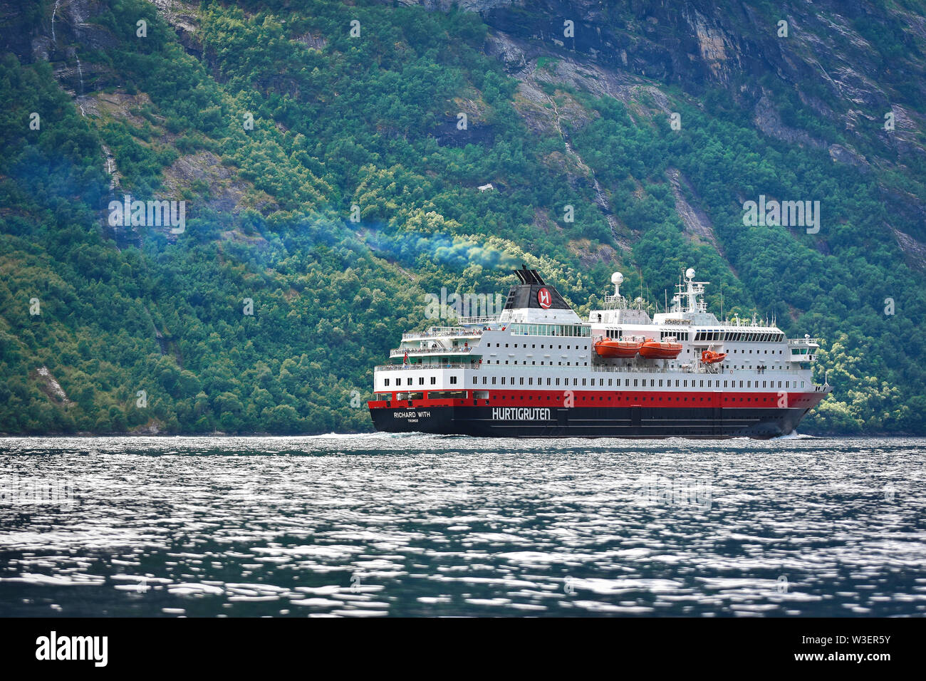 Hurtigruten Ferry cruise at Geirangerfjord , stunning natural masterpiece included in UNESCO World Heritage Stock Photo