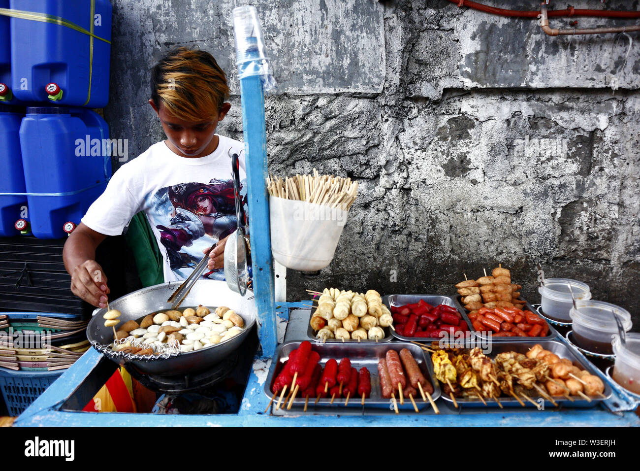Man selling fried fish balls hi-res stock photography and images