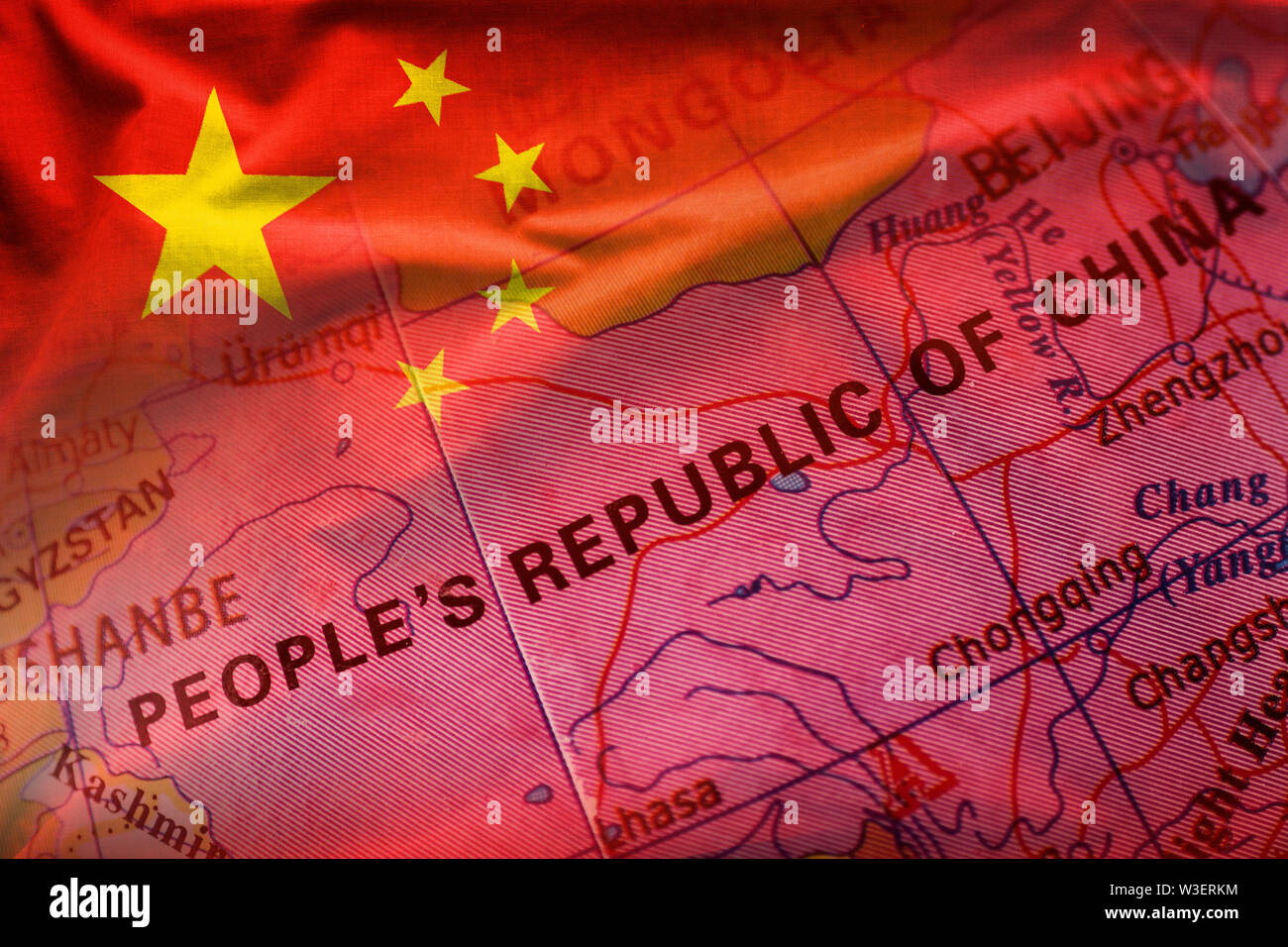 Peoples Republic of China on a world globe in close up focus with an overlay of the Chinese flag Stock Photo