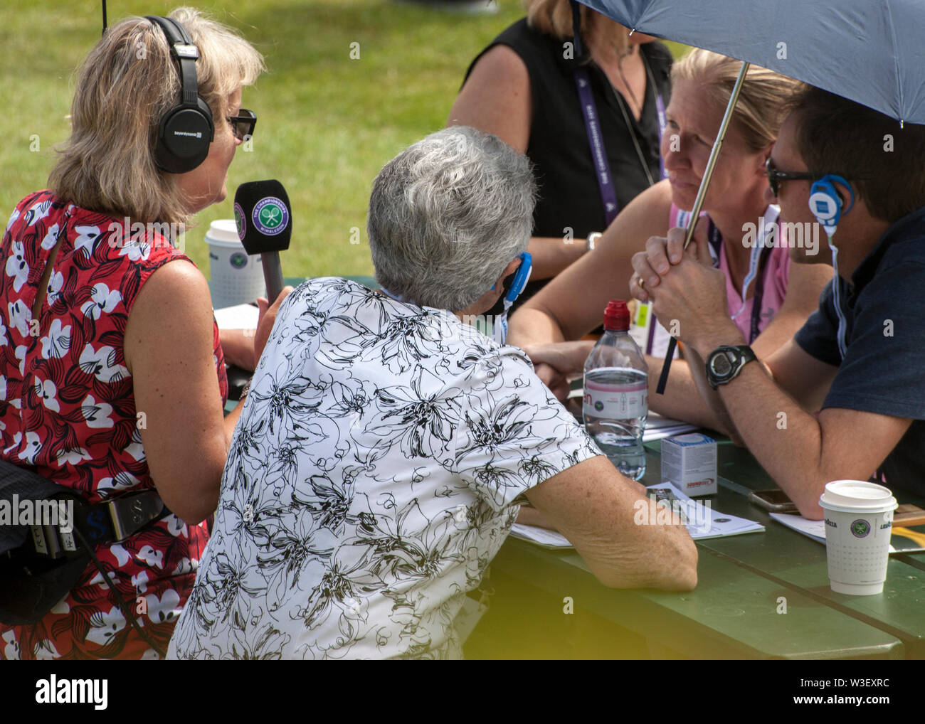 wimbledon radio presenter interviewing spectators on Henman hill / Murray mount at 2019 Wimbledon tennis championship Stock Photo