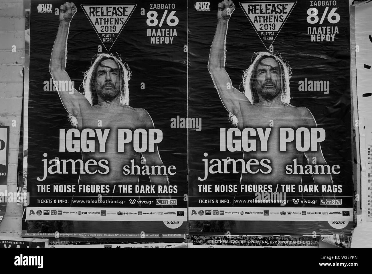 ATHENS, GREECE - MAY 20, 2019: Wall with Iggy Pop rock music concert posters. Black and white. Stock Photo