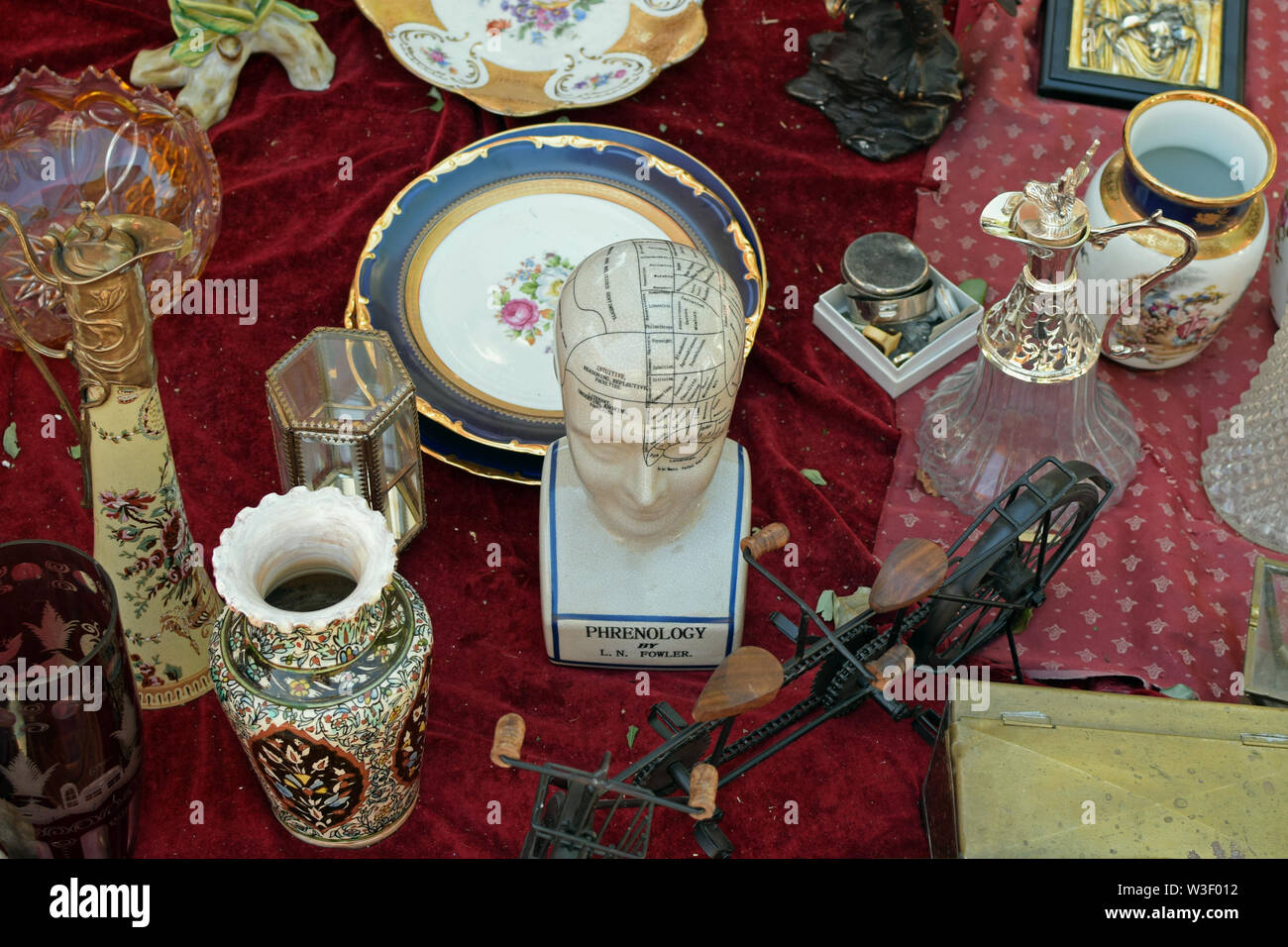 ATHENS, GREECE - AUGUST 14, 2016: Antique objects and porcelain phrenological bust with areas of the head assigned to specific character traits and br Stock Photo
