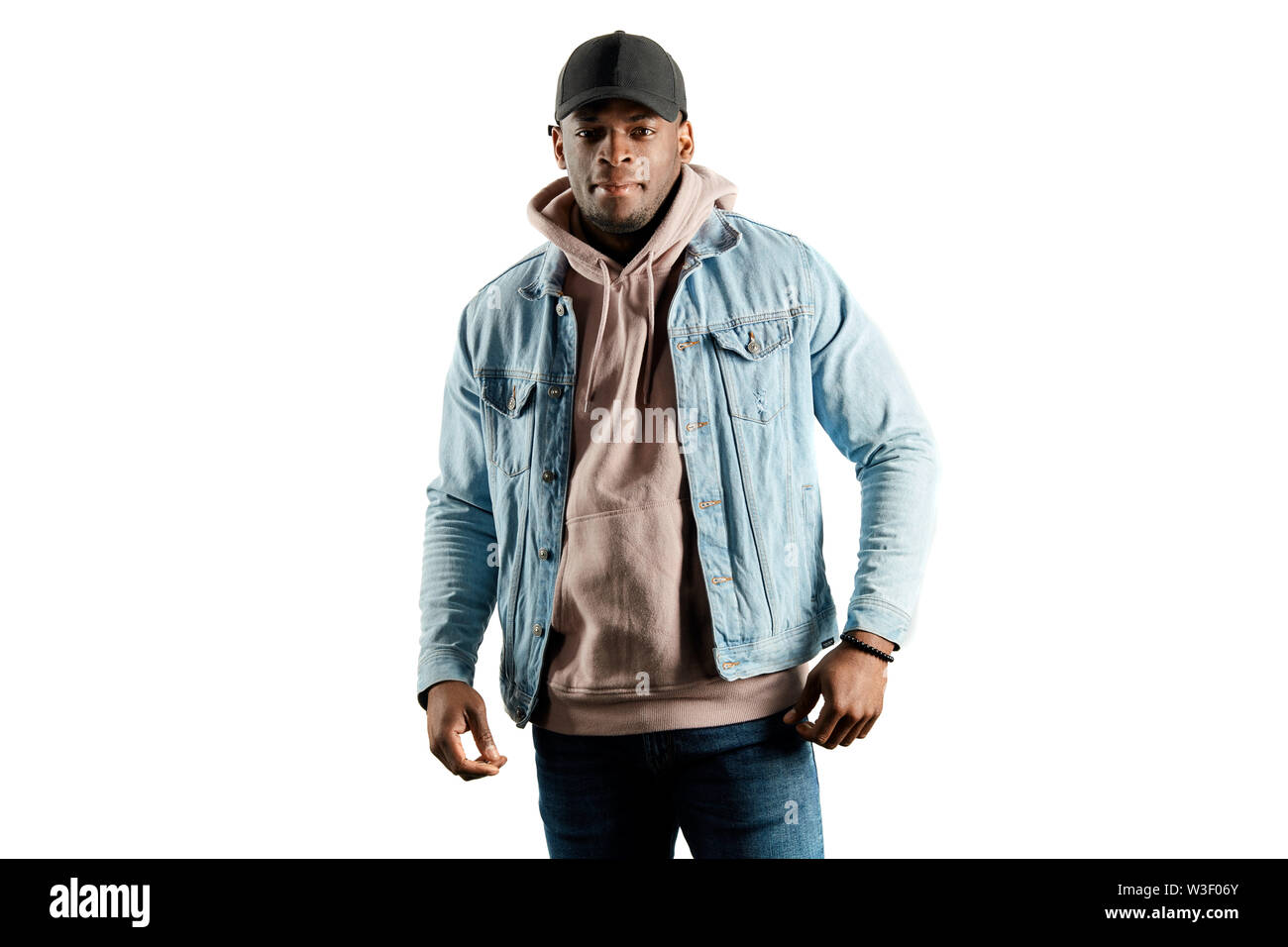 awesome cool strong guy dressed casually looking at the camera. isolated white background. studio shot, lifestyle, interest. street look Stock Photo