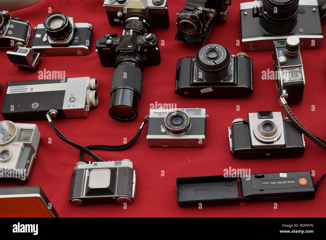 ATHENS, GREECE - APRIL 1, 2018: Vintage photo and video cameras for sale at street market. Antique photography equipment. Stock Photo