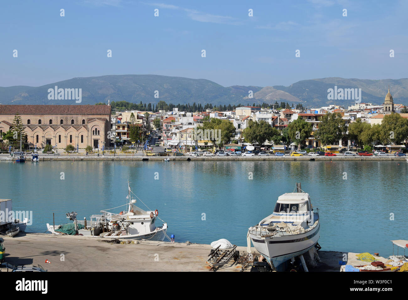 ZAKYNTHOS, GREECE - AUGUST 23, 2018: View of Zakynthos town and fishing boats at the port. Stock Photo