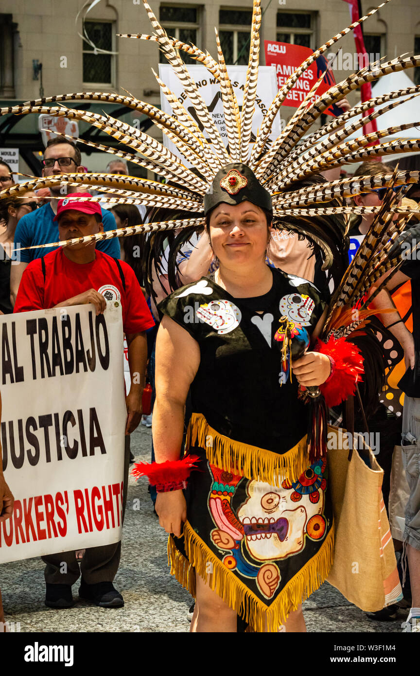 Downtown, Chicago-July 13, 2019: Protest against Immigration ICE and Border Patrol. A Mexican woman dressed in native Aztec costume and headdress. Stock Photo