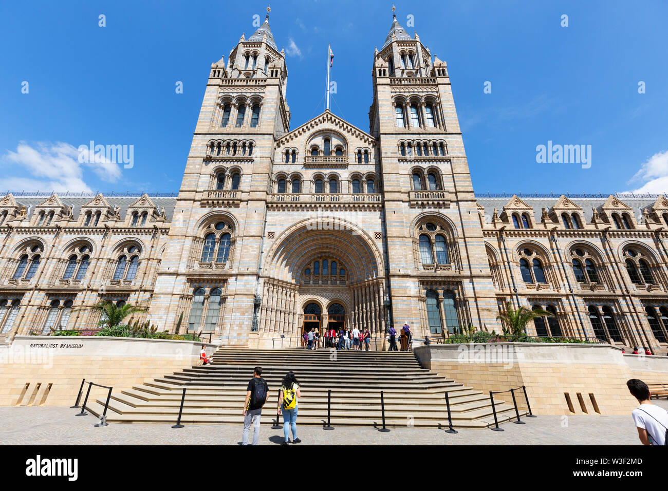 Natural History Museum London outside; Visitors at the main entrance, Exhibition Road, South Kensington London UK Stock Photo