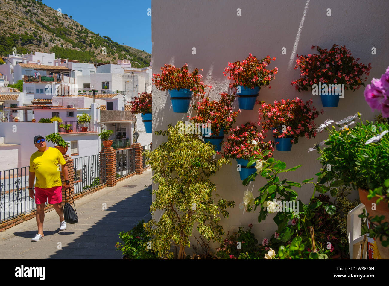 Typical street with flowers, white village of Mijas. Malaga province Costa del Sol. Andalusia, Southern Spain Europe Stock Photo