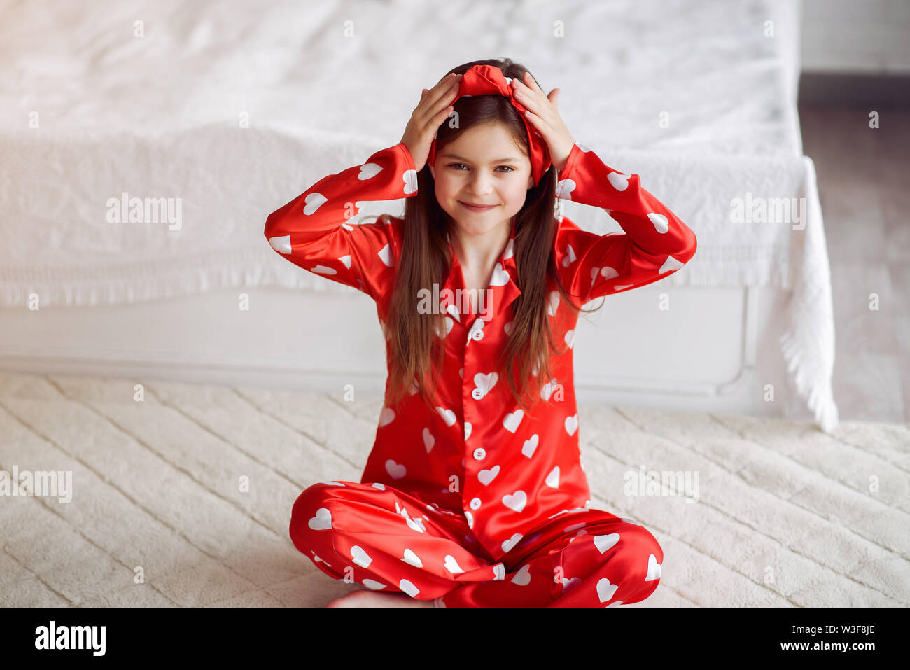 Cute little girl at home in a pajamas Stock Photo - Alamy