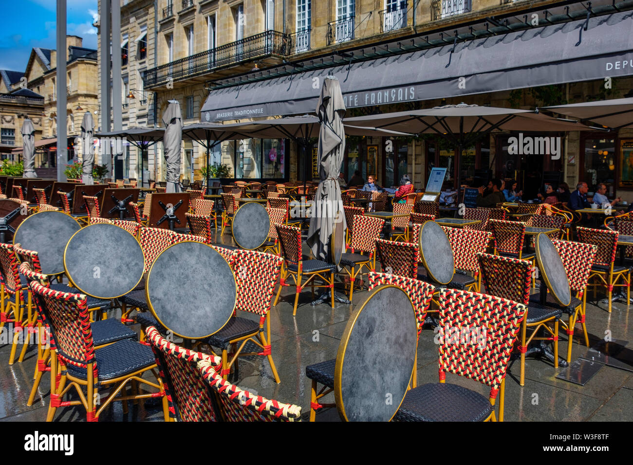 Chairs and tables on the terrace of a cafe in the historic center. Bordeaux, Gironde. Aquitaine region. France Europe Stock Photo