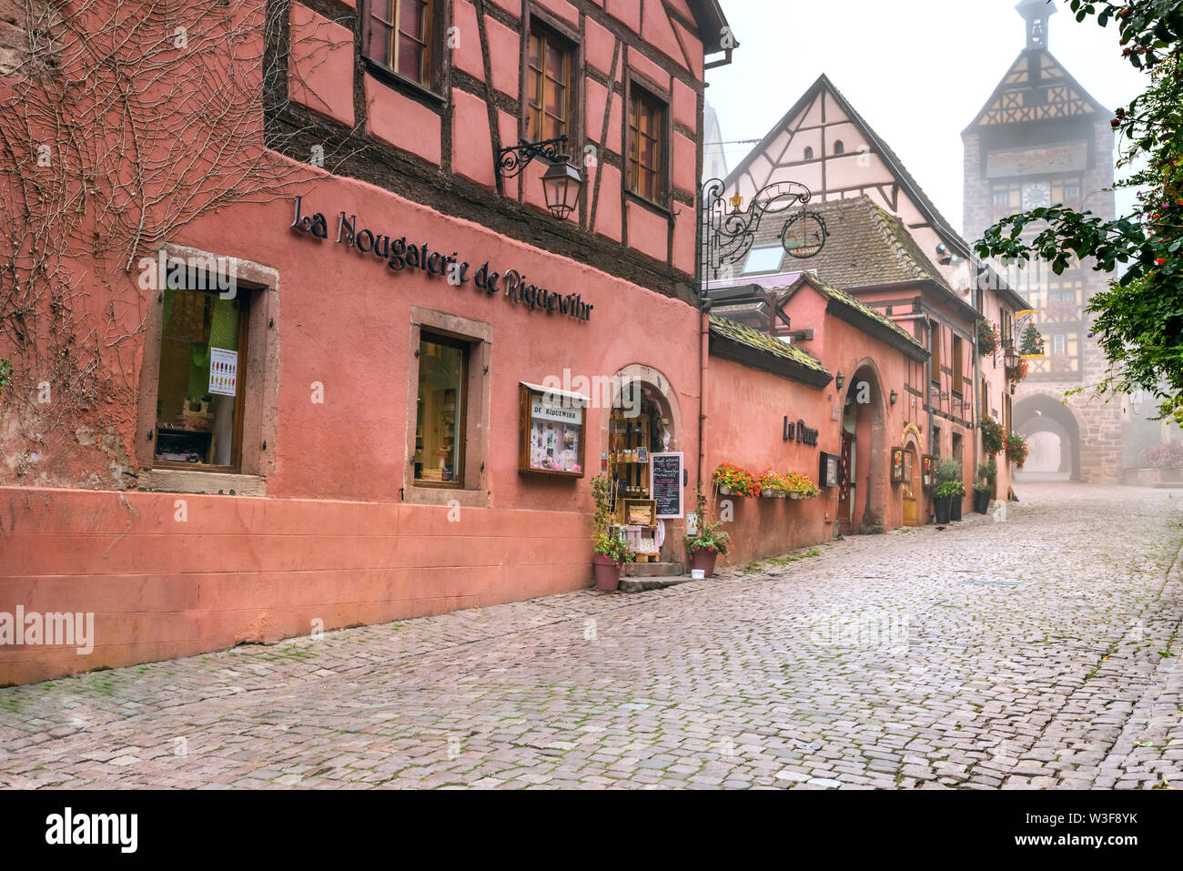medieval town and tourist destination Riquewihr, village of the Alsace Wine Route, France, medieval mood in the autumn fog Stock Photo