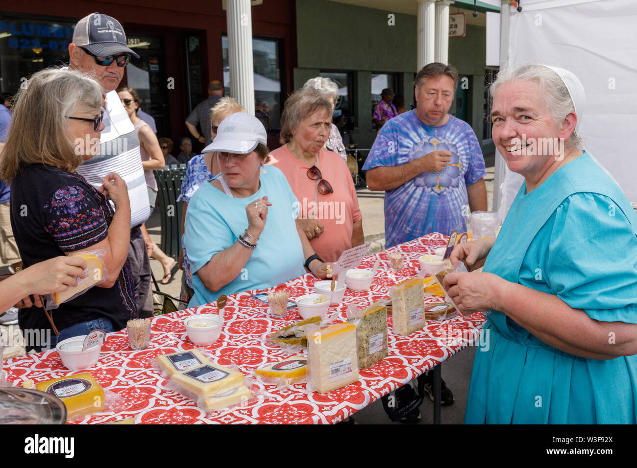 Mennonite woman vendor annual Little Falls Cheese Festival in Herkimer County, New York, USA Stock Photo