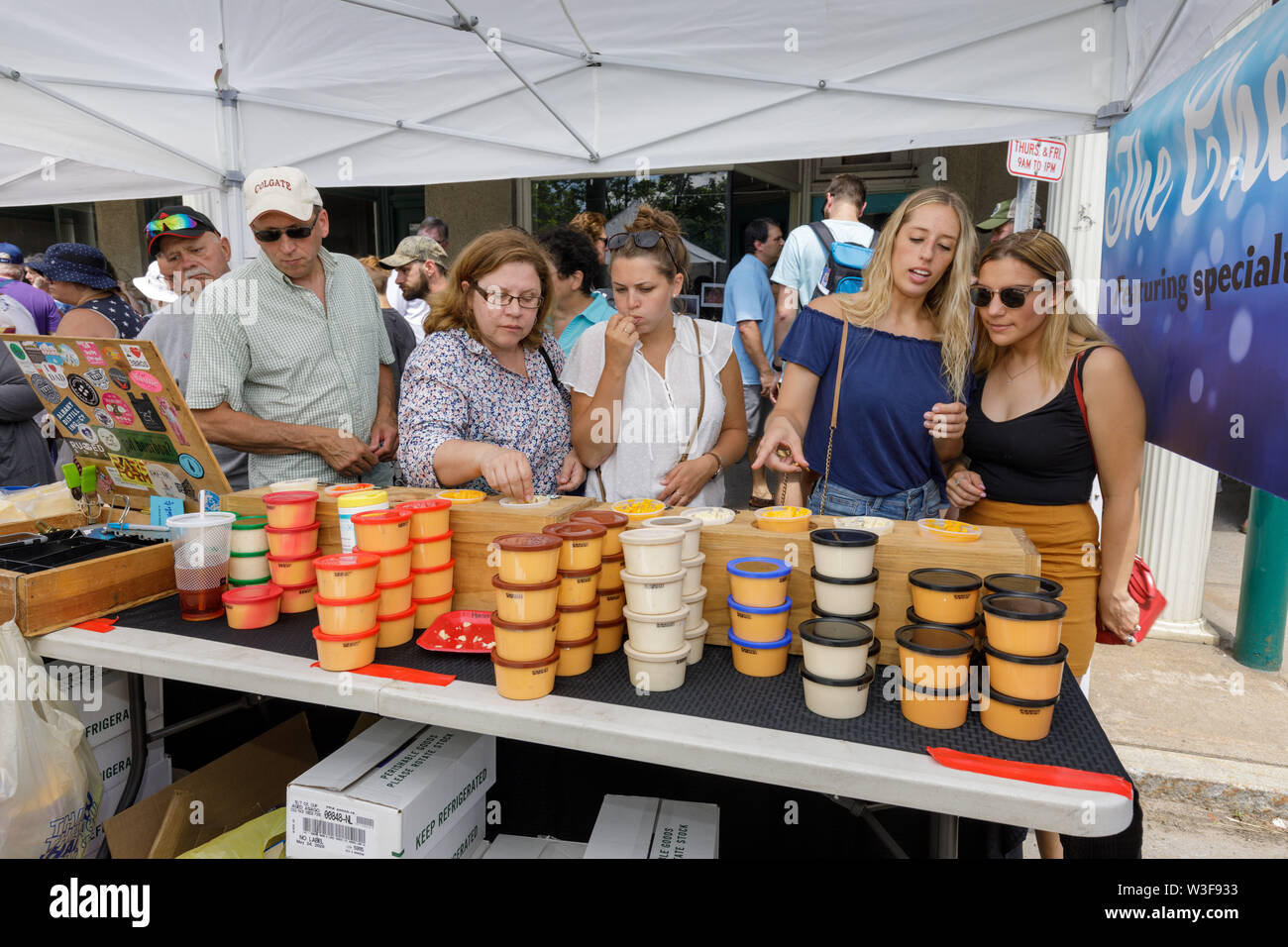 Customers enjoy samples at the annual Little Falls Cheese Festival in Herkimer County, New York, USA. Stock Photo