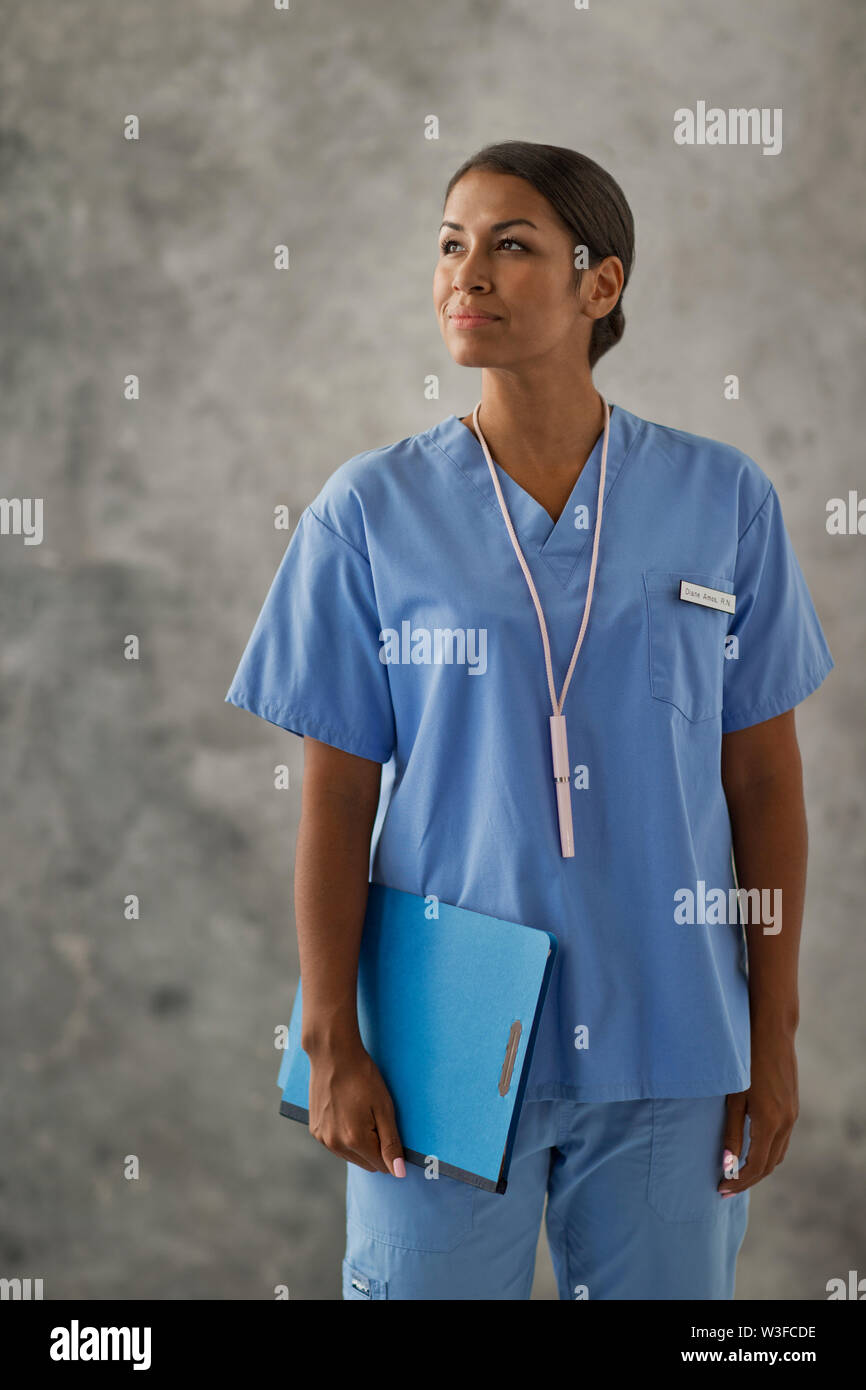 Portrait of a nurse holding a clipboard. Stock Photo