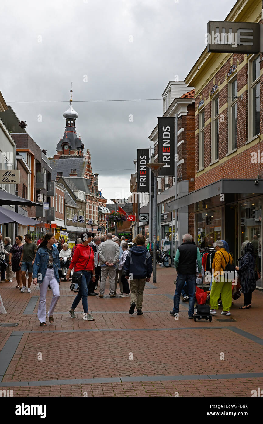 winschoten, netherlands - 2019.07.13:  people strolling on winschoten main shopping lane langestraat - background left: town hall building Stock Photo